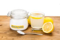 Baking soda with lemon juice in glass for multiple holistic usages