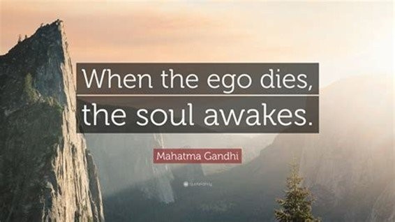 Scenic mountain landscape at sunrise with a quote that reads ‘When the ego dies, the soul awakes,’ attributed to Mahatma Gandhi.