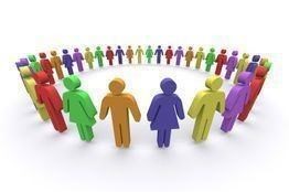 Colorful group of people standing together in a circle.