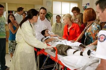 Medical team treating a patient during an emergency.