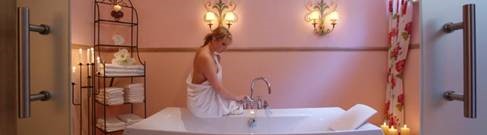 Woman preparing a therapeutic magnesium bath.